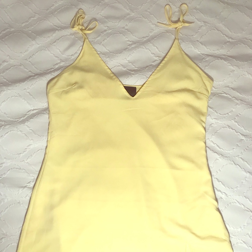 Pale yellow spaghetti tie strap mini dress